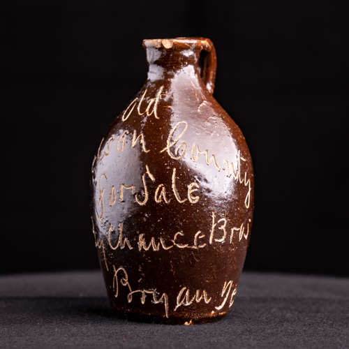 1890-1910 Texas stoneware mini jug with advertising for Chance Brothers in Bryan Texas on it.