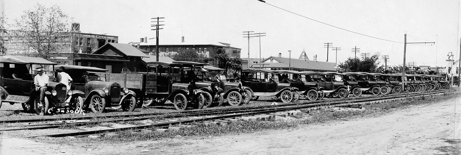 cars at train tracks