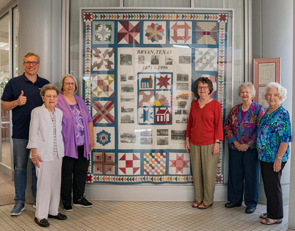 Mayor Andrew Nelson and members of the Brazos Bluebonnet Quilt Guild in May 2021.