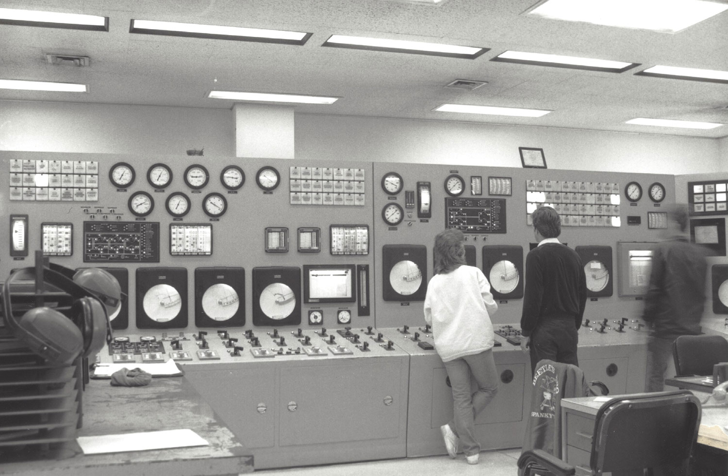 BTU workers monitoring gauges in the 1980s or 1990s.