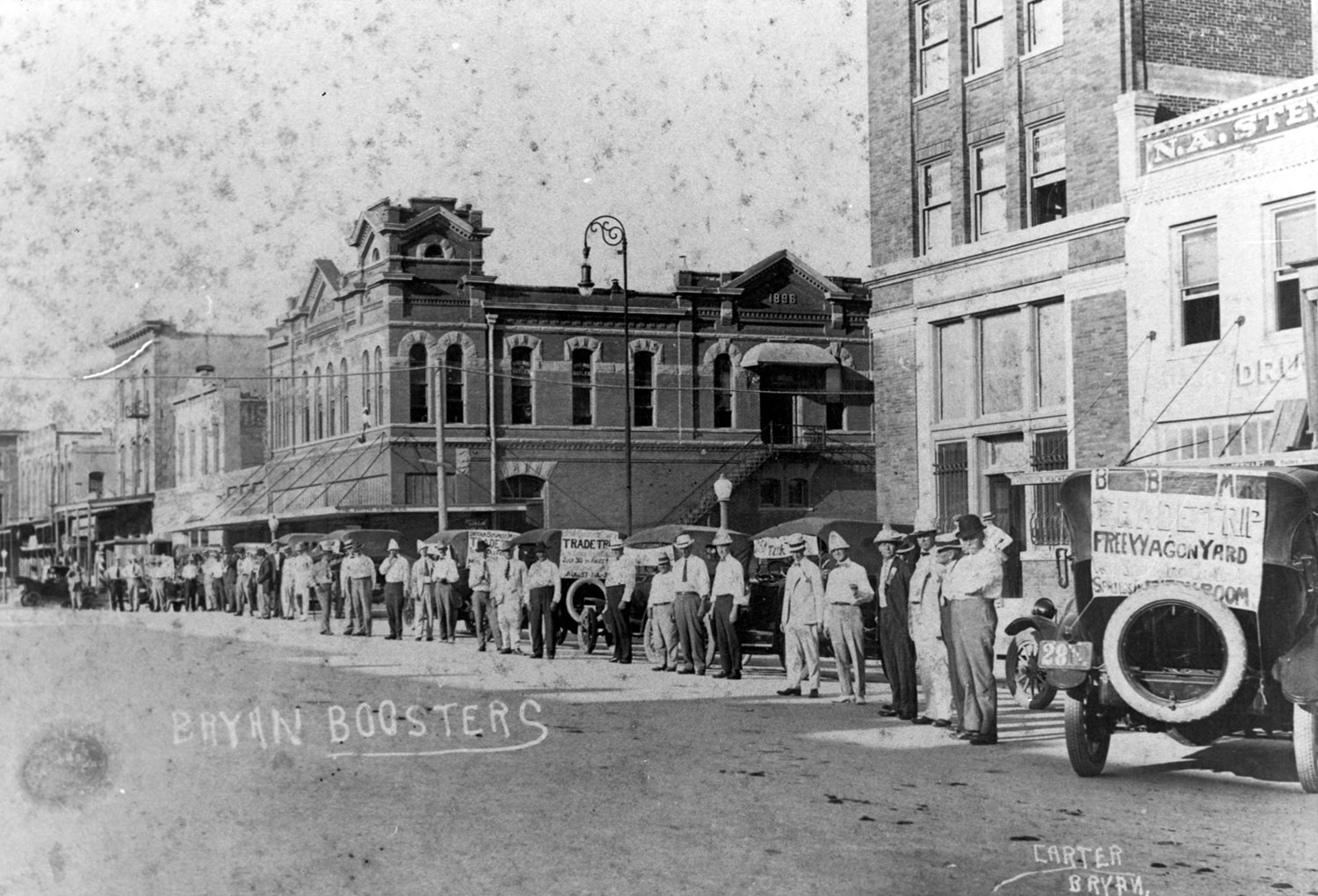 Bryan Boosters -- merchants line up for a "Trade Trip" to the Brazos County river bottom in the late 1920s or early 1930s. Merchants carried wares and distributed handbills and promotional items on such trips.